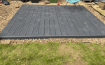 Gray composite deck on gravel
