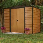 Woodvale metal shed with wood-look siding, two doors, and flower pots.