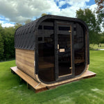Outdoor sauna with black roof and glass door - PHOTO-2024-04-10