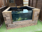 Window pond with visible fish and wooden frame