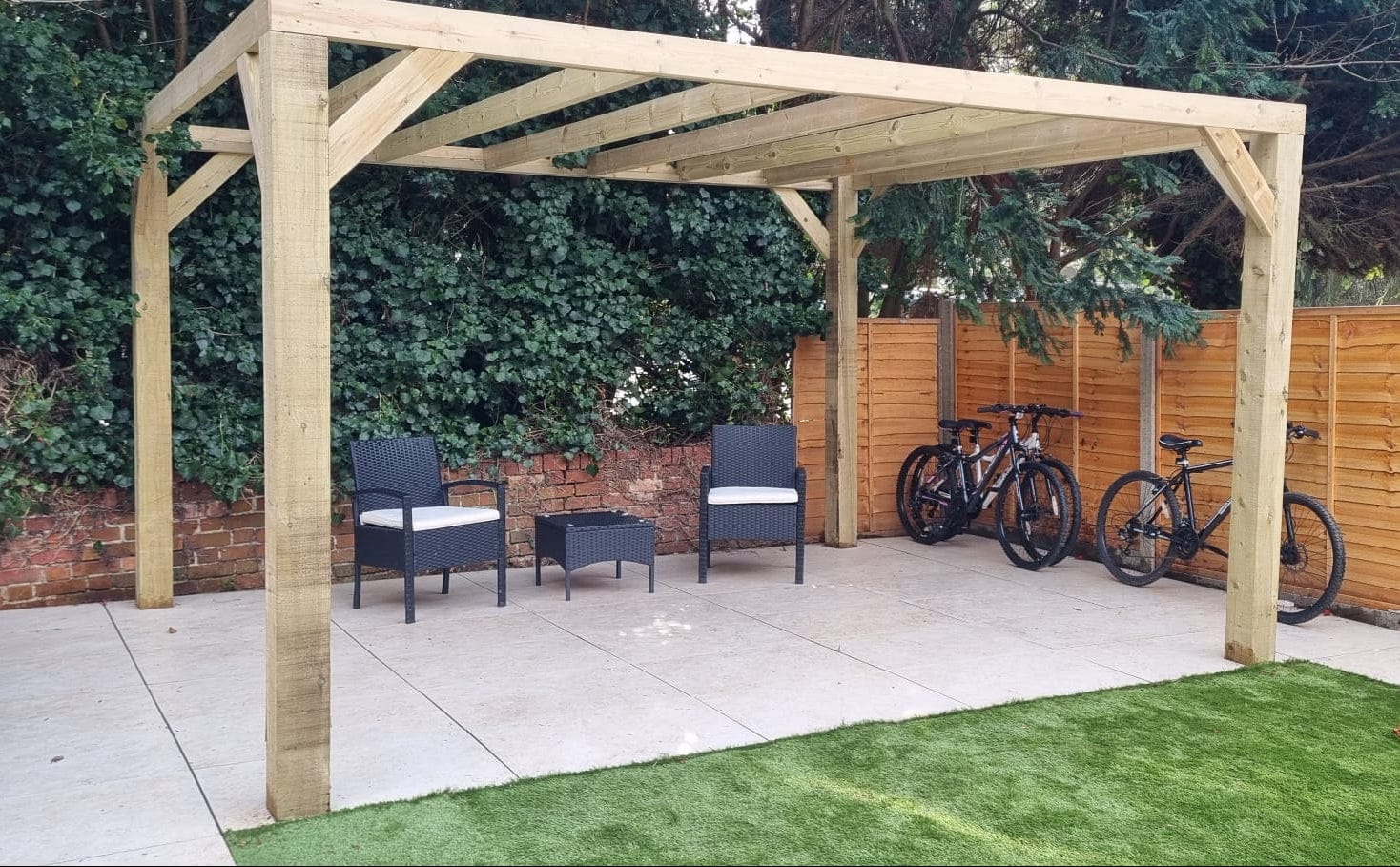 Wooden pergola with seating and bikes