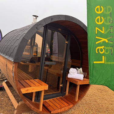 Barrel sauna with Layzee Living sign