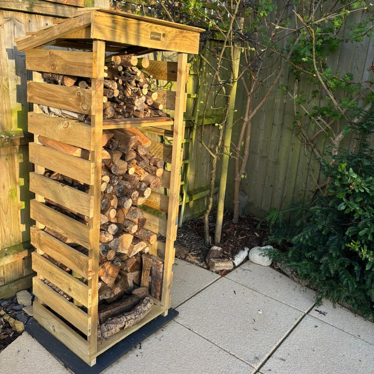 Narrow log store with kindling shelf, tanalised timber
